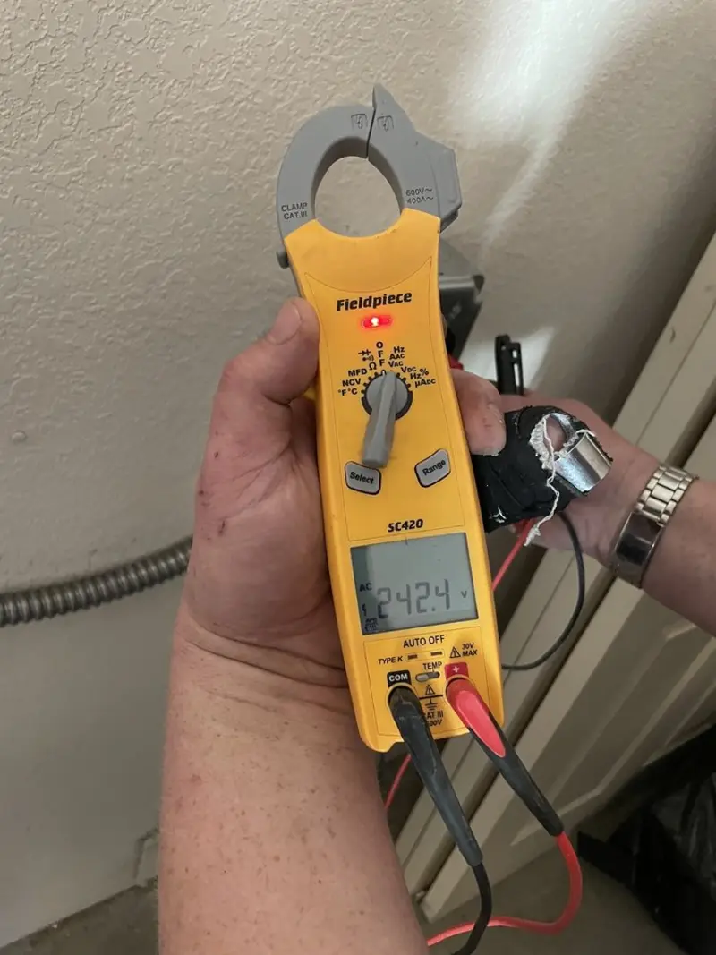 Voltage testing with clamp meter during Electrical Installation Services in Appleton